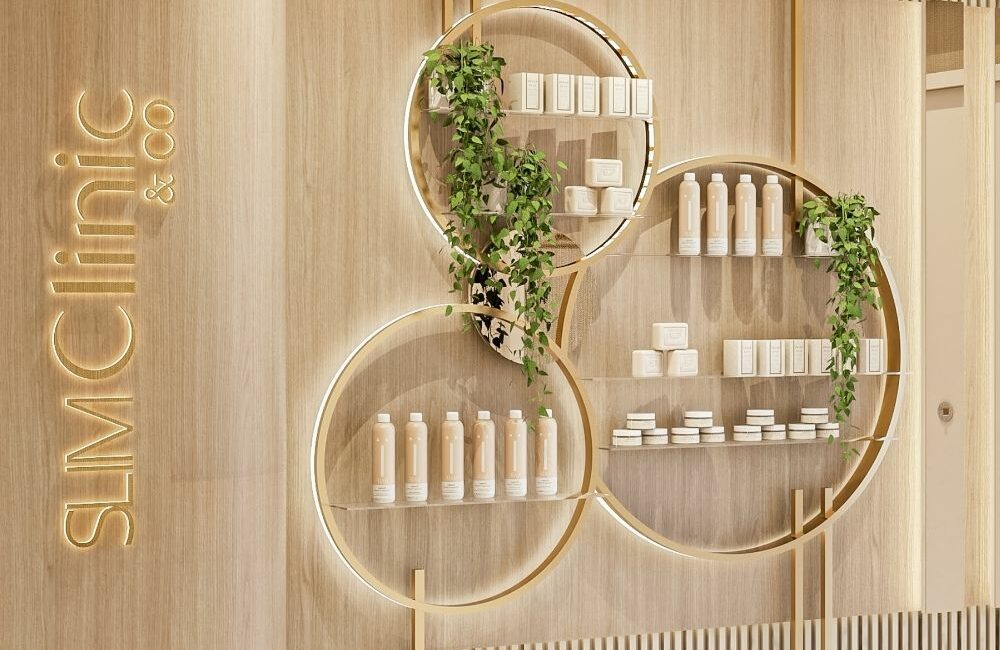 Reception with illuminated logo wall and product display. interior architect